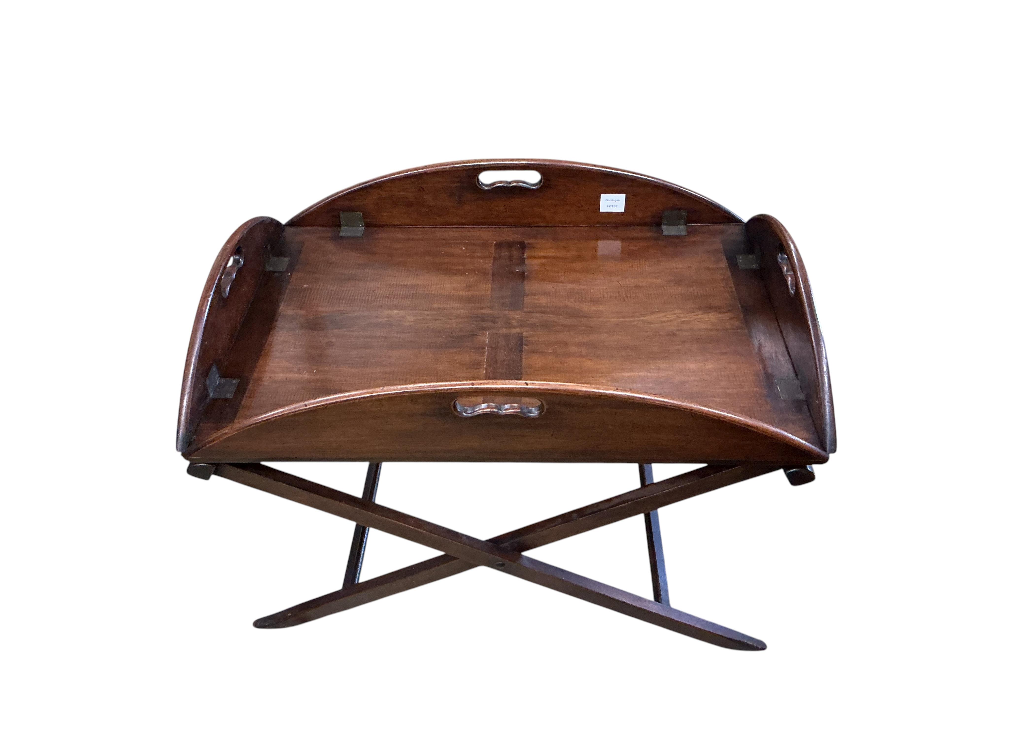 A reproduction Victorian style mahogany butler's tray on folding stand, width 82cm, depth 57cm, height 58cm